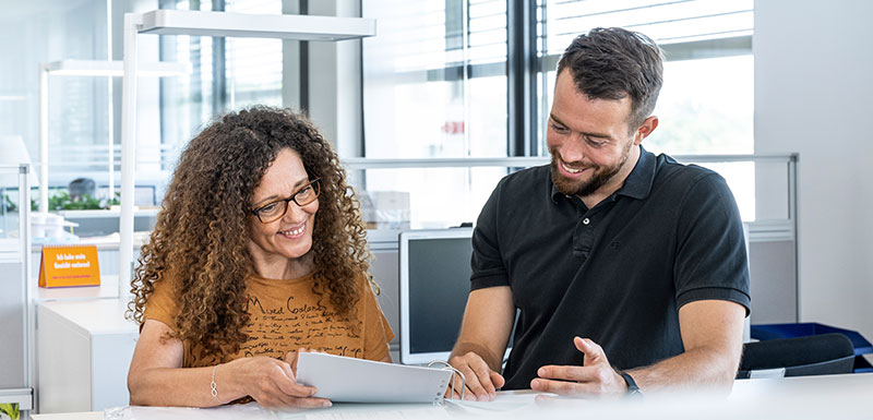 Two employees are talking